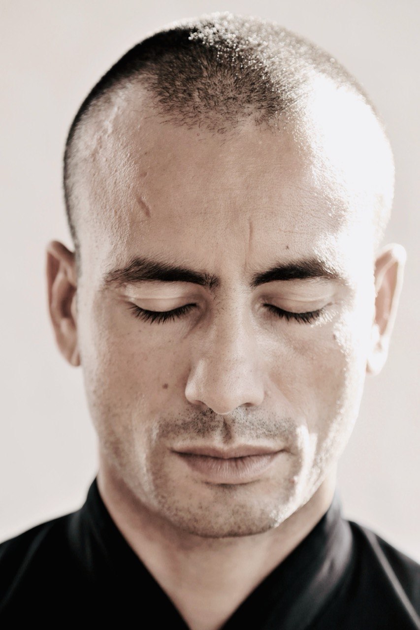 John Sammut in deep meditation — eyes closed, still presence